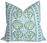 Fair Isle pillow cover in blue and green with ivory linen backing draped on a sofa