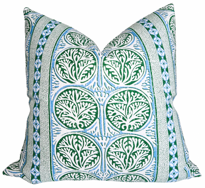 Fair Isle pillow cover in blue and green with ivory linen backing draped on a sofa