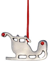Silver sleigh Christmas ornament with two red ruby-like accents and a red hanging string attached through the middle section.