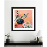 Framed painting of a blue vase holding pink and yellow flowers next to a patterned teacup on a saucer with a spoon, set against a warm peach background.