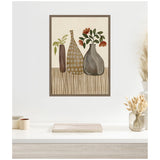 Abstract still life painting of three differently shaped vases with muted earth tones and simple floral elements on a striped surface, framed and hung on a white wall.