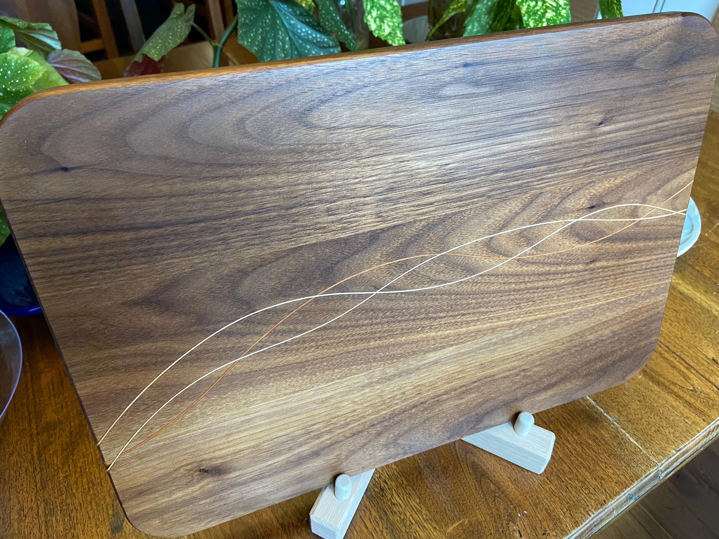 Handcrafted Walnut charcuterie board with Cherry and Maple decorative banding
