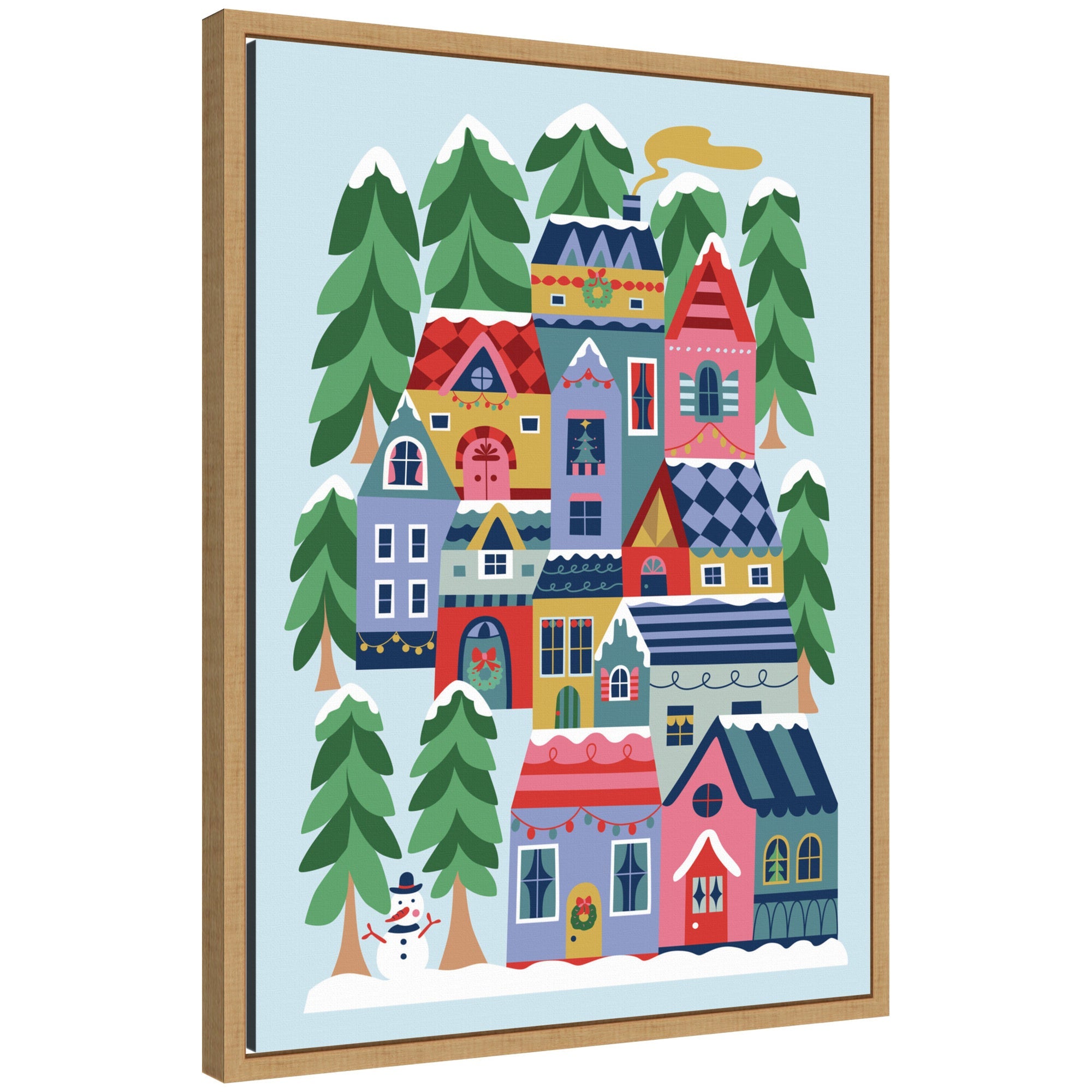 Sylvie Framed Canvas art showing a whimsical winter village scene with colorful houses, snow, evergreen trees, and a snowman.