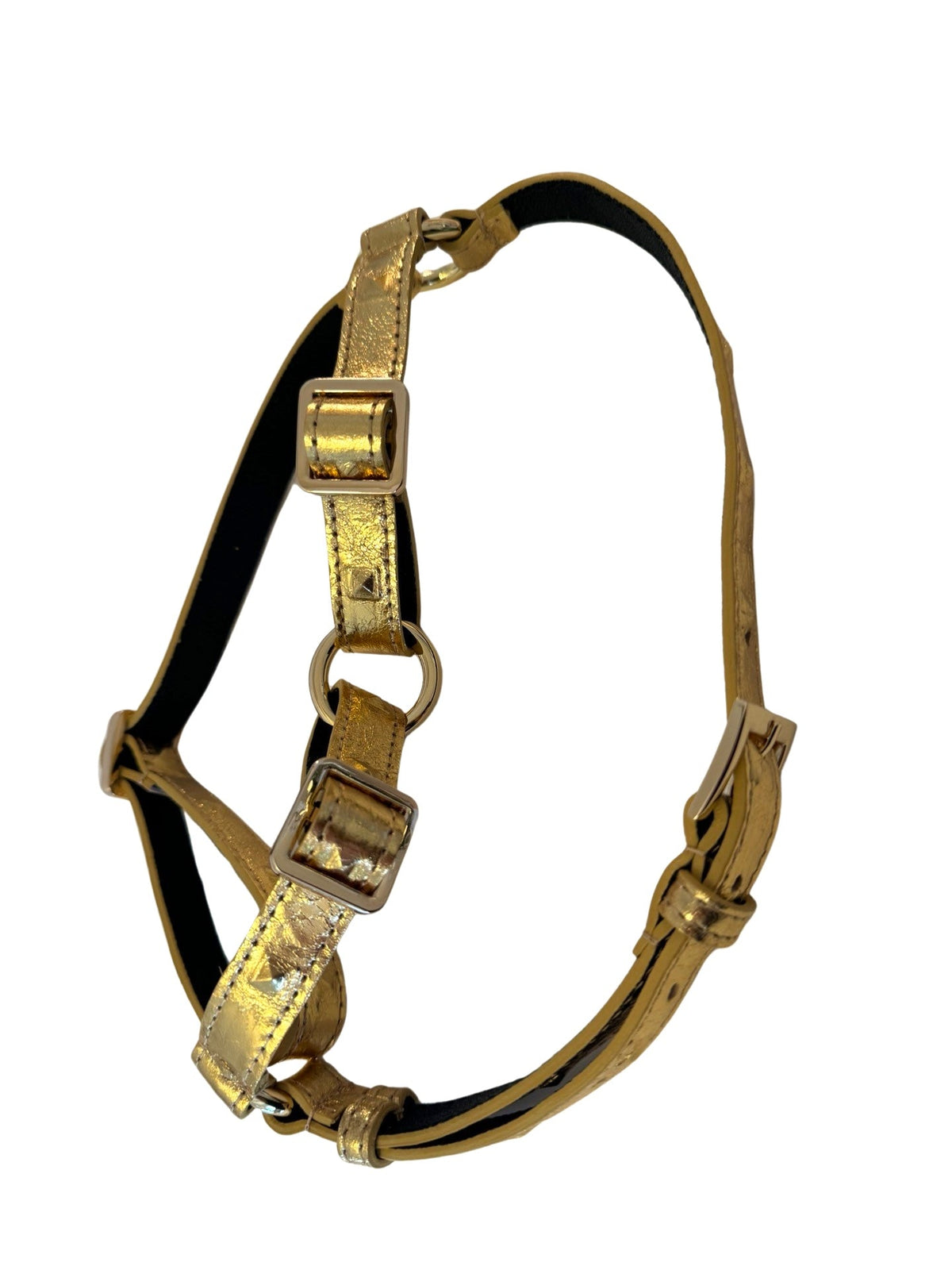 Gold embossed Italian leather harness with studded detailing and adjustable buckles, shown isolated on a white background.