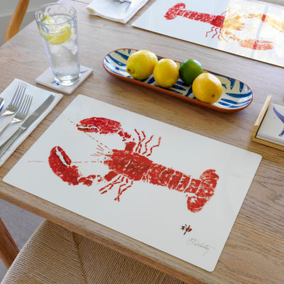 Set of 10 red lobster coastal placemats on a dining table