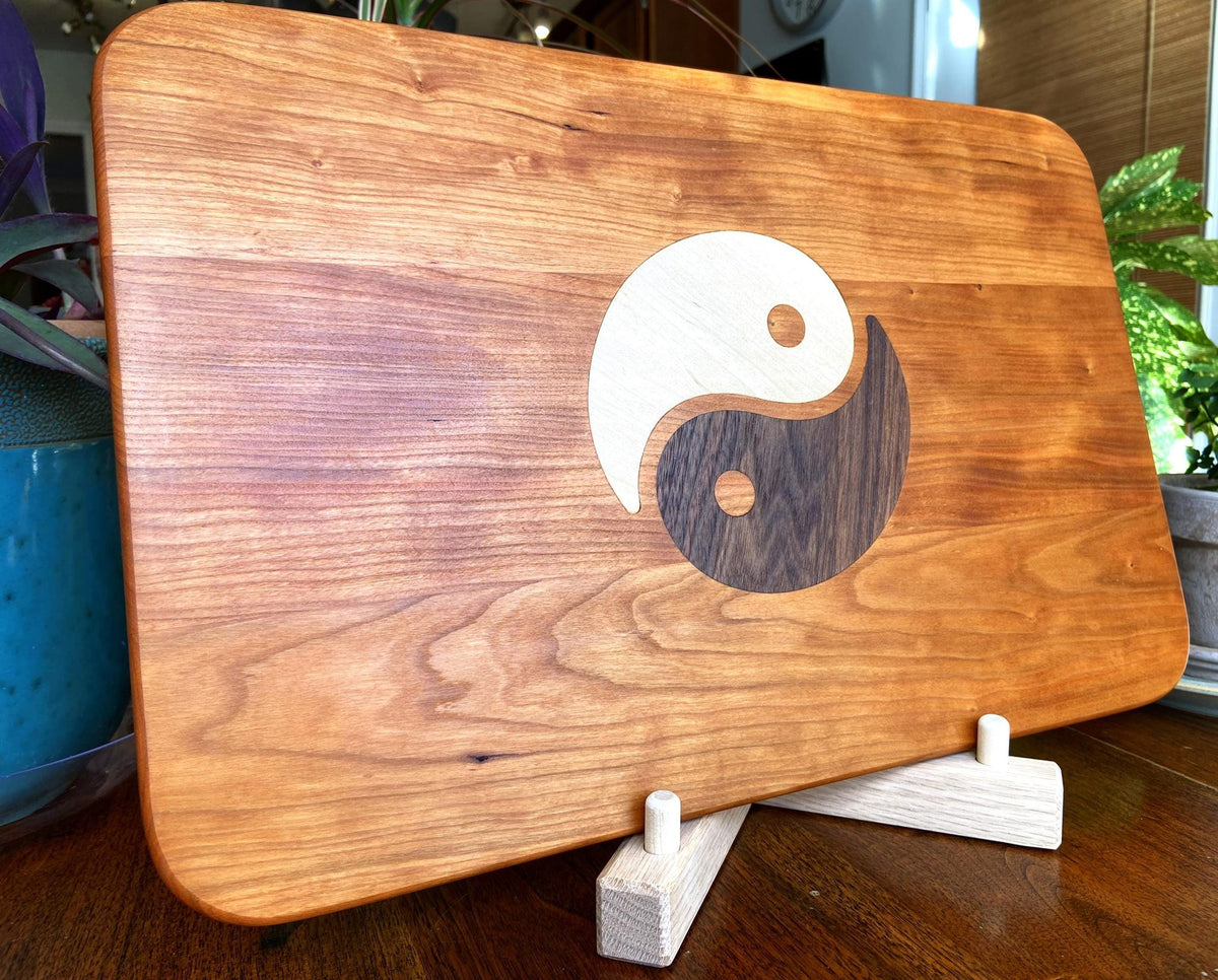 Cherry wood charcuterie board with Yin Yang inlay of Maple and Peruvian Walnut