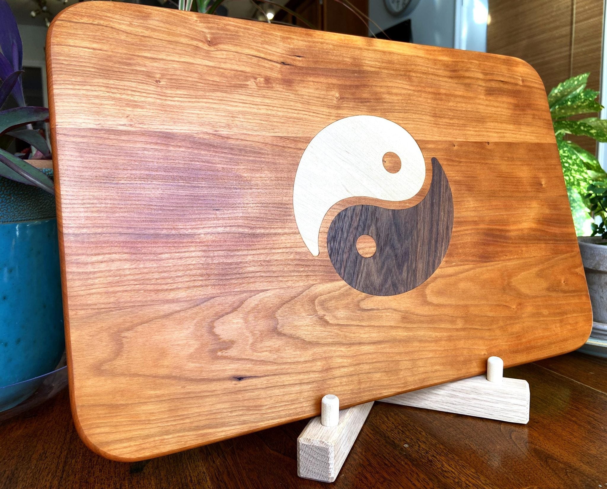 Cherry wood charcuterie board with Yin Yang inlay of Maple and Peruvian Walnut