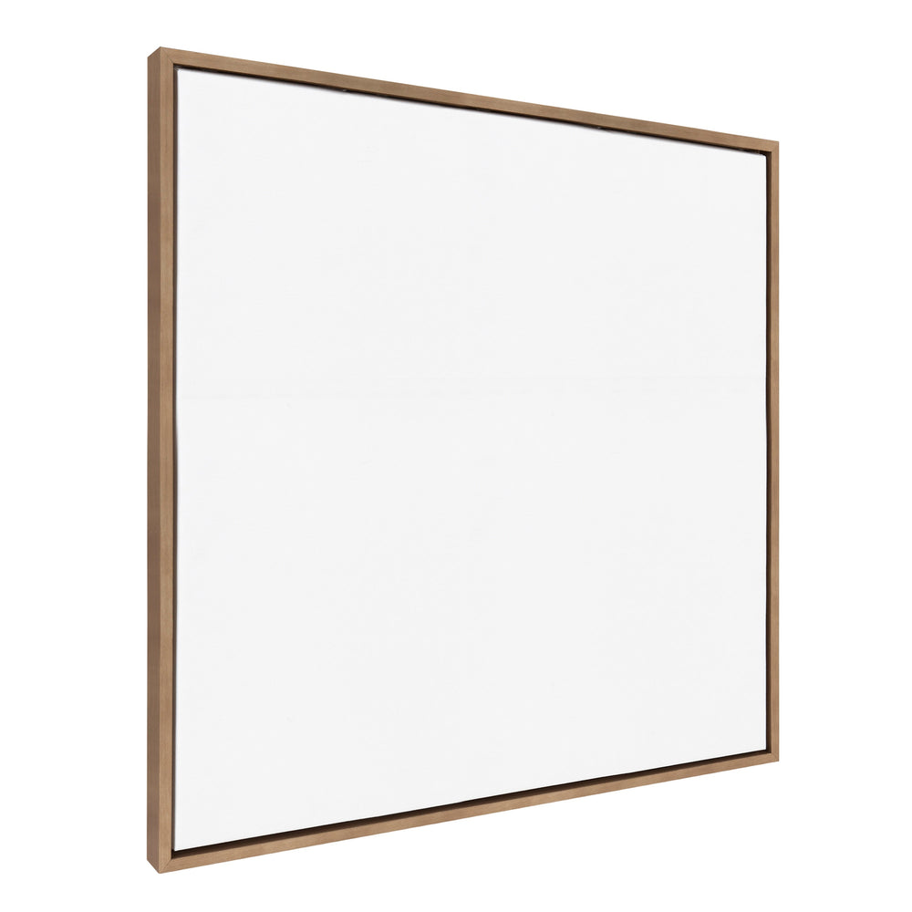 Sylvie Blank Framed Canvas in Beaded Gold, 30x30 size, leaning on a white wall