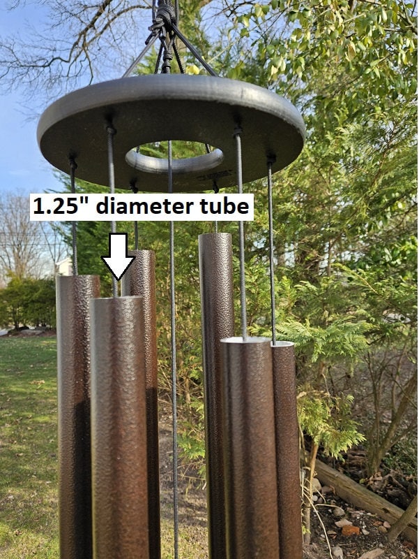 Amish handmade aluminum wind chimes in various sizes hanging outdoors