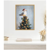 Framed canvas of a seagull wearing a red Santa hat perched atop a decorated Christmas tree with glowing golden lights against a soft blue-gray background.