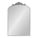 Rectangular silver-framed arch mirror with ornate floral scrollwork decoration at the top center of the frame.