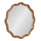 Round mirror with a scalloped wooden frame featuring smooth, flowing curves and a warm brown finish, shown against a plain white background.