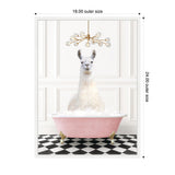 White llama sitting upright in a pink clawfoot bathtub filled with bubbles on a black-and-white checkerboard floor, under a modern chandelier with multiple globe lights.