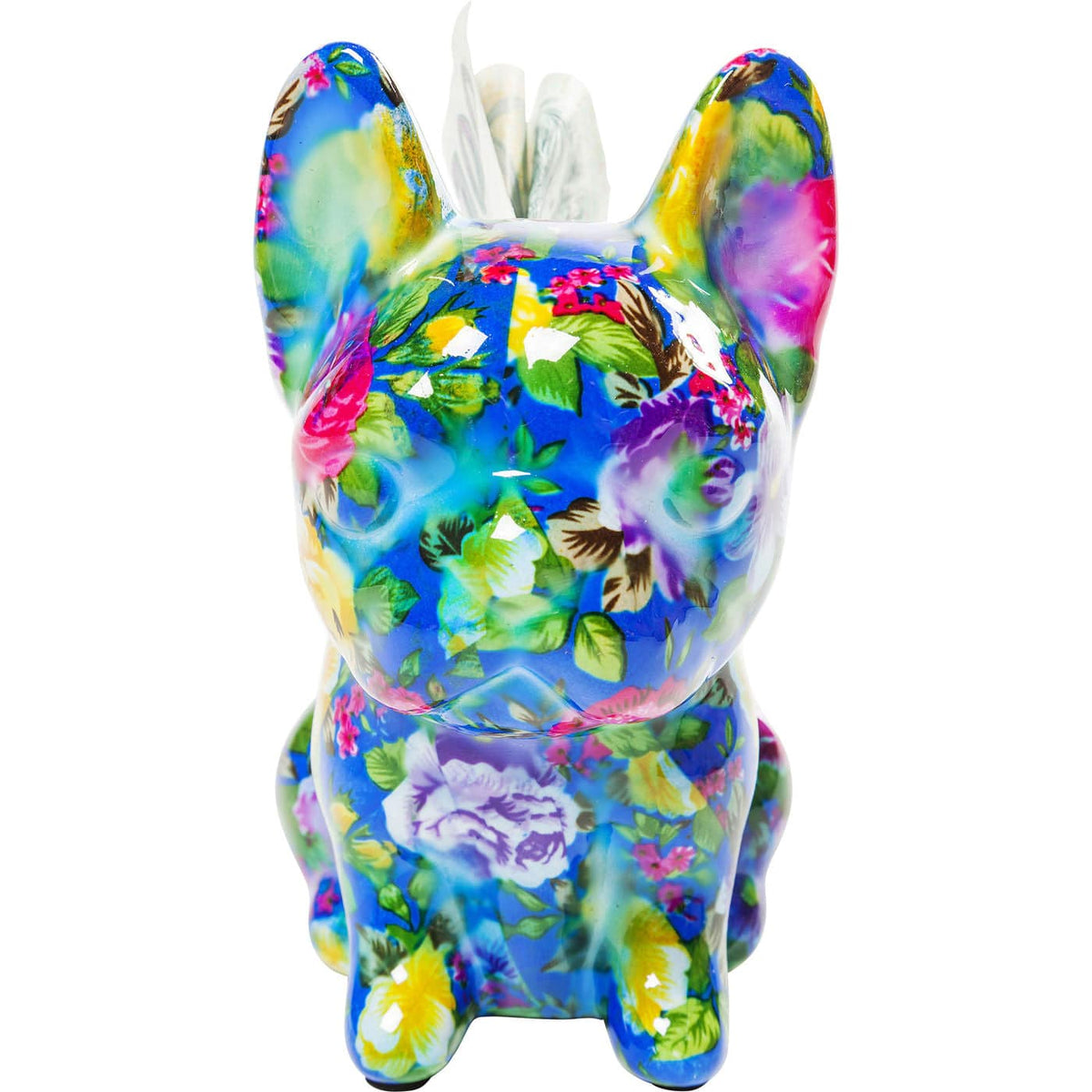 Small dog-shaped money box covered in a vibrant floral pattern with blue, green, pink, and yellow colors, shown from a front angle.