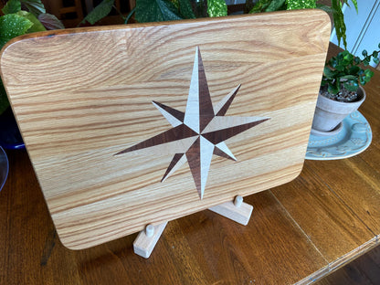 Handcrafted white oak charcuterie board with compass rose inlay