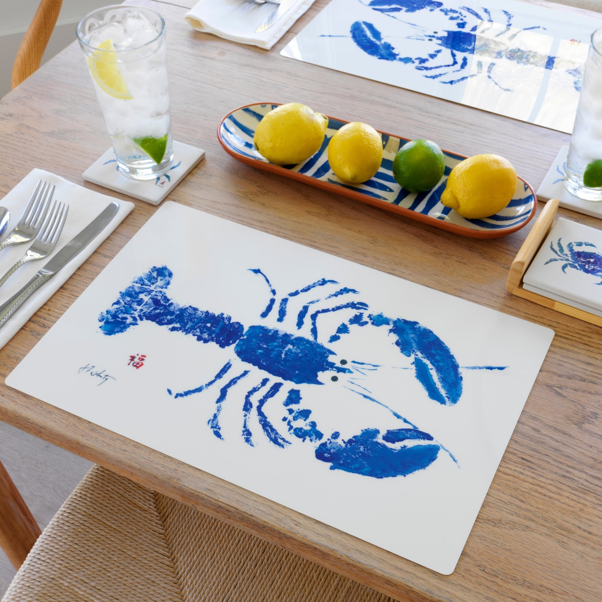 Blue lobster vinyl placemat with coastal design