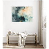 Abstract canvas with swirling teal, navy, and peach ink patterns framed and hung above a wooden bench with a folded blanket and open book in a bright room.