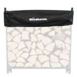 Woodhaven Short Firewood Rack Seasoning Cover in black on a firewood rack