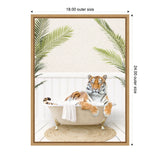 A tiger lounging in a cream clawfoot bathtub draped with a white towel, surrounded by green palm leaves against a white paneled wall, framed in light wood.