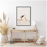 Minimalist framed print showing two arms in white sleeves, one pouring champagne from a black bottle into a glass held by the other, against a light beige background.