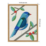 Stylized bluebird composed of geometric shapes perched on a gray branch with green leaves and red berries, set against a beige background in a wooden frame.