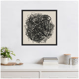 Framed canvas wall art featuring chaotic black abstract lines and loops on a beige background, hanging above a white dresser with plants and books.