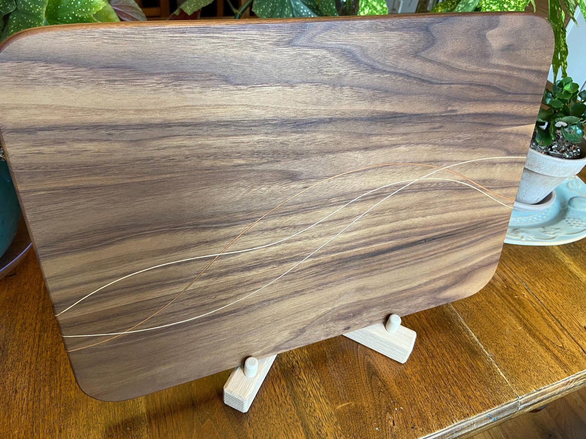 Walnut charcuterie board with cherry and maple decorative banding by Fitzgerald Custom Woodcraft