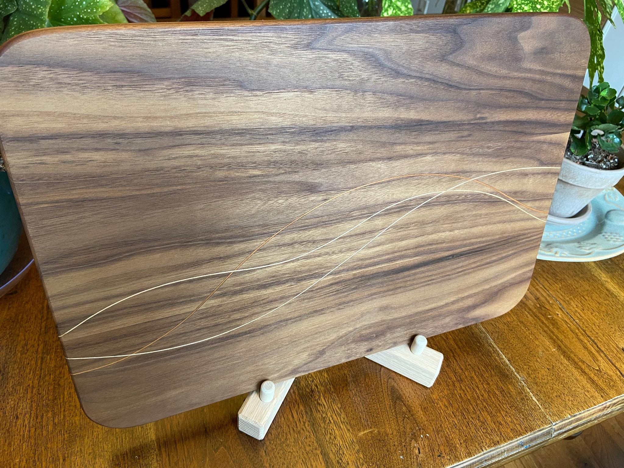 Walnut charcuterie board with cherry and maple decorative banding by Fitzgerald Custom Woodcraft