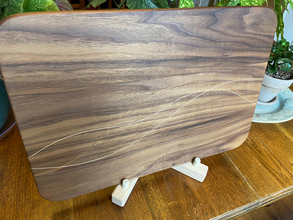 Walnut charcuterie board with cherry and maple decorative banding by Fitzgerald Custom Woodcraft