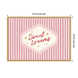 Rectangular wall art with vertical pink and white stripes, featuring a central cream-colored diamond shape with red cursive text 'Sweet Dreams' surrounded by small yellow stars.