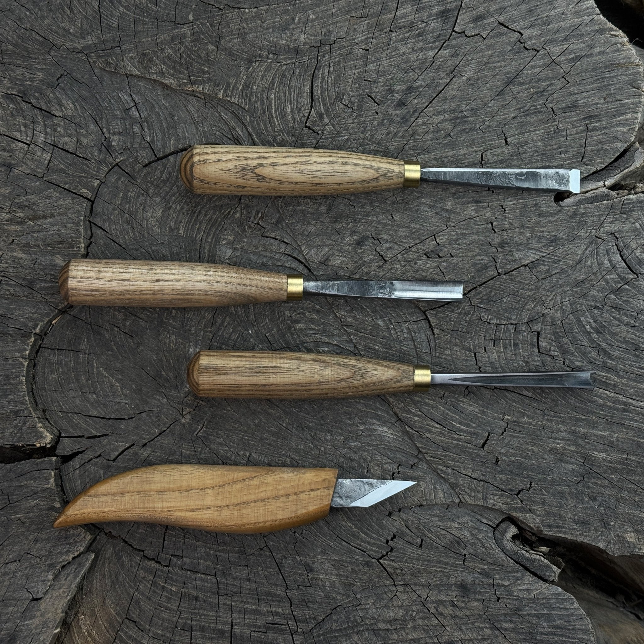 4-piece hand-forged wood carving tool set with ash wood handles and steel blades