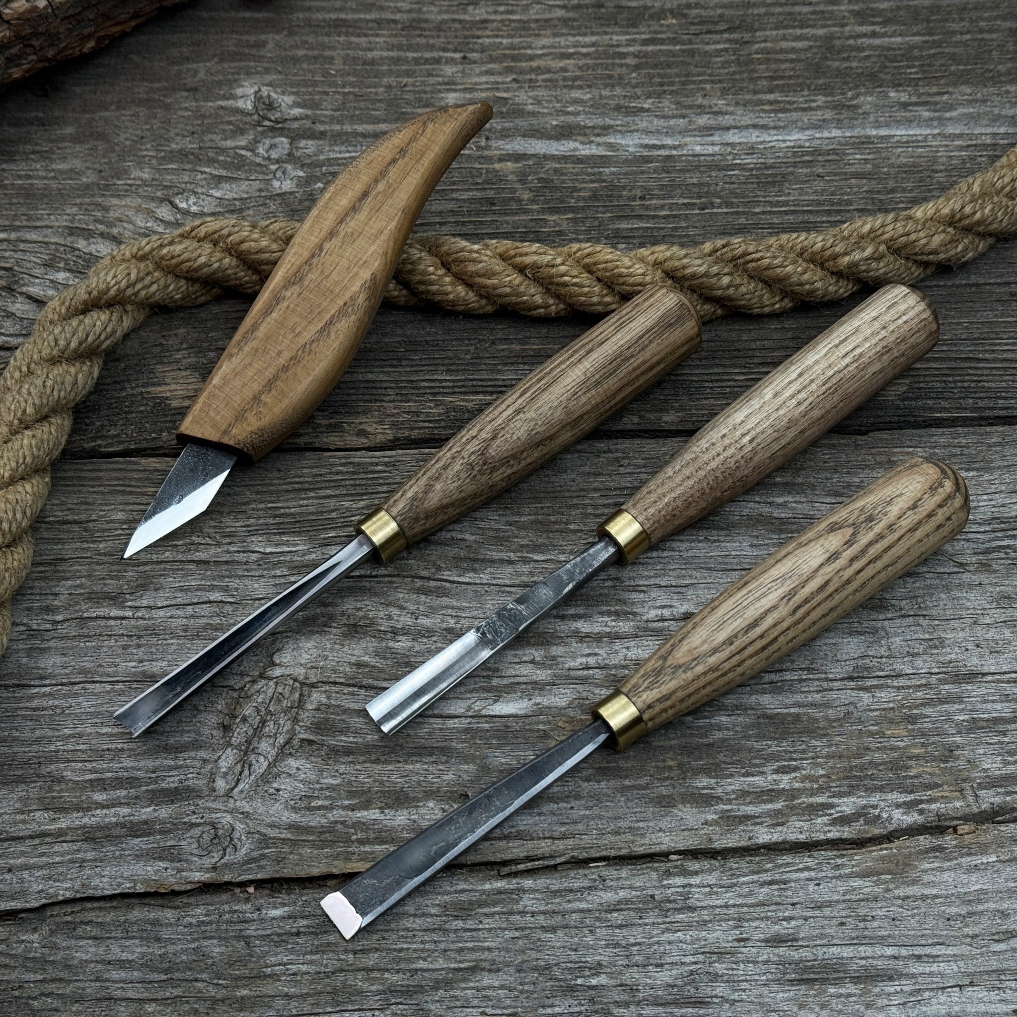 4-piece hand-forged wood carving tool set with ash wood handles and steel blades