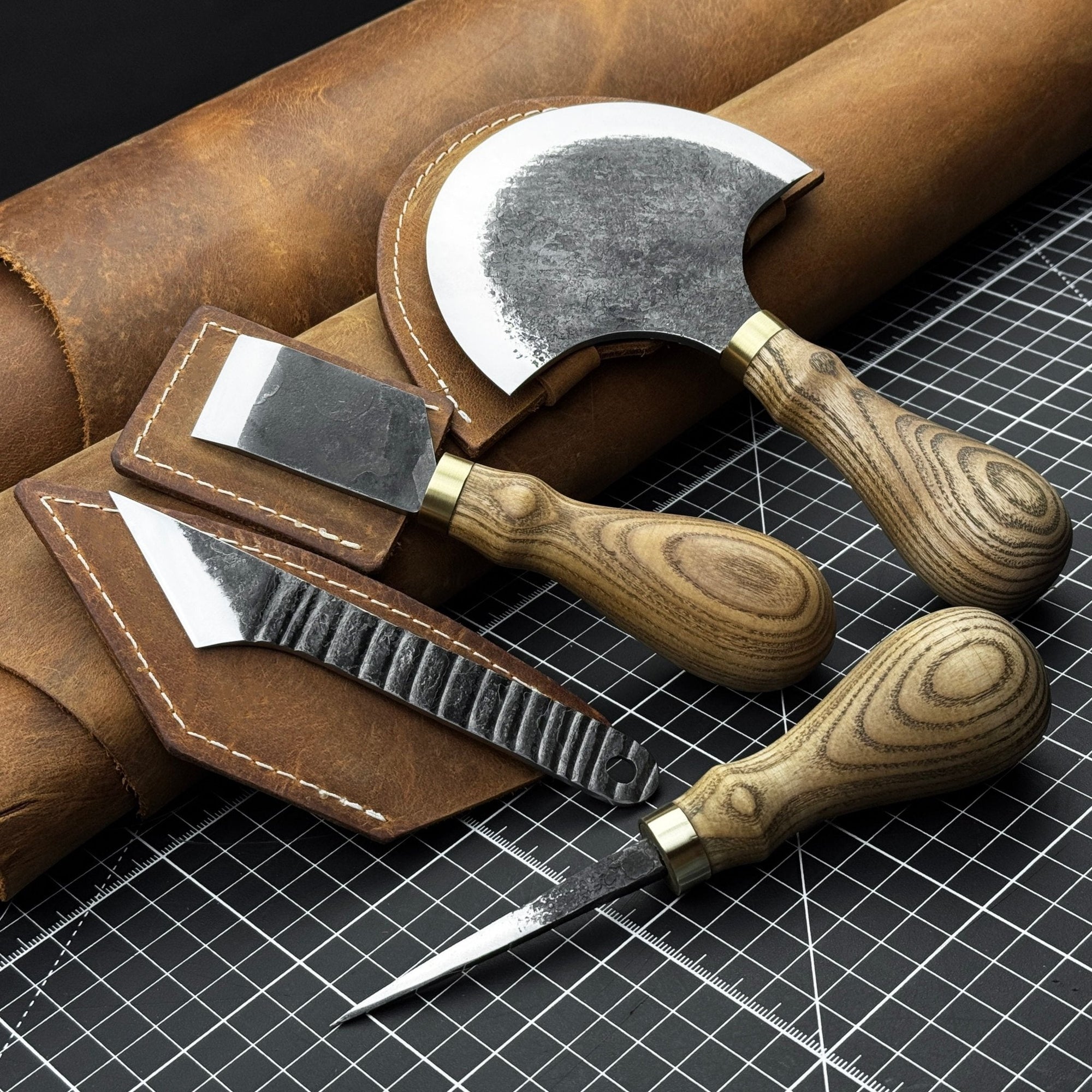 4-piece leather tool set with leather sheaths including half moon knife, skiving knife, kiridashi knife, and awl