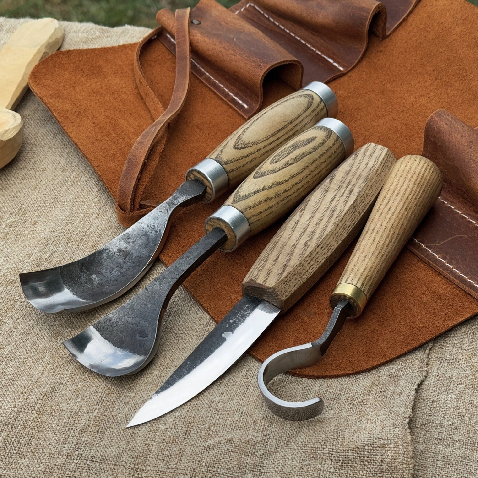 4-piece spoon carving tool set with leather roll by Sharky Forged Steel Tools