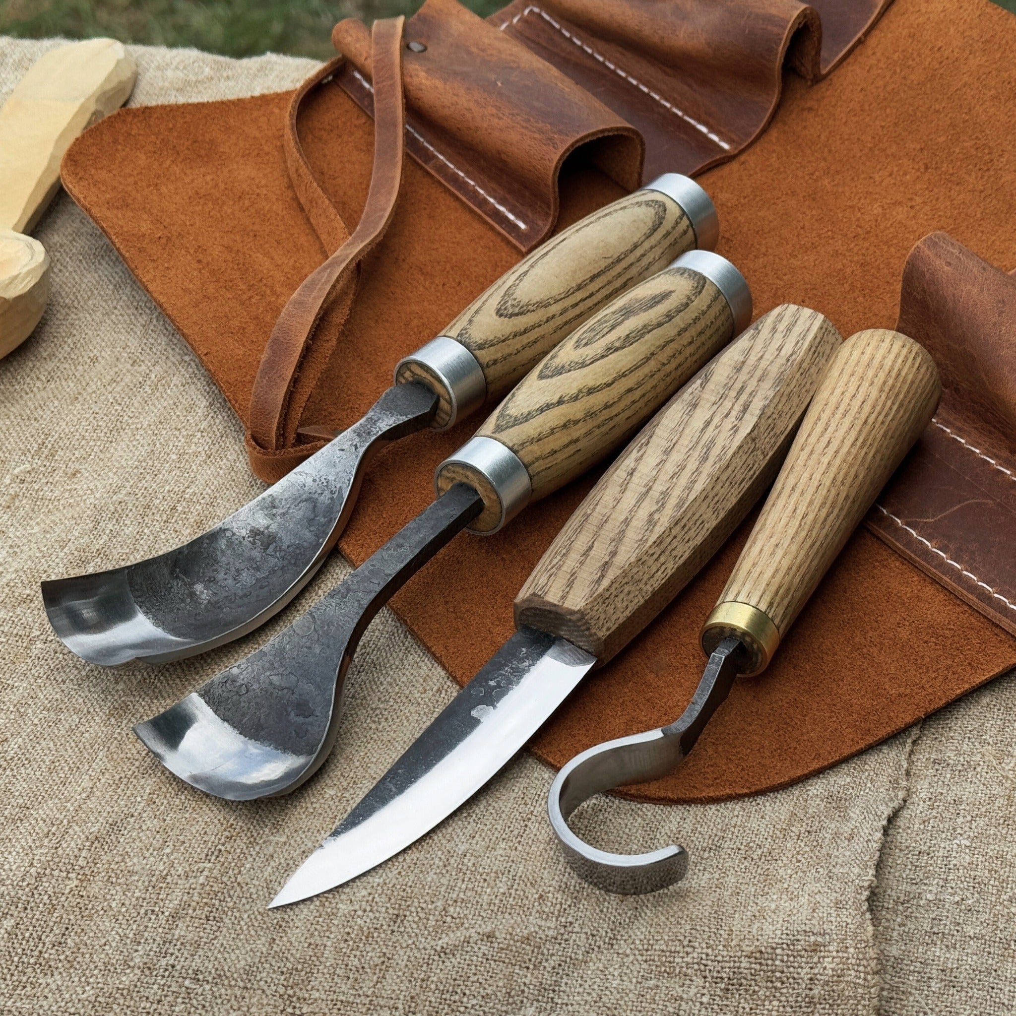 4-piece spoon carving tool set with leather roll by Sharky Forged Steel Tools