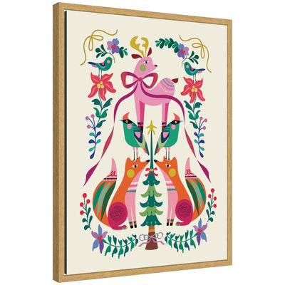 Framed canvas showing a colorful winter woodland scene with a deer adorned with a large bow, two foxes, birds, and lush floral patterns.