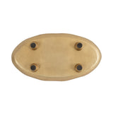 Oval-shaped decorative tray with a textured gold finish shown from the underside featuring four small black circular feet.