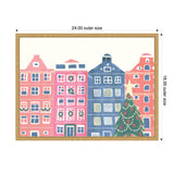 Watercolor illustration of four stylized row houses in pink and blue with a decorated Christmas tree featuring a star on top in front, framed in wood.