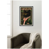 Framed wall art of a black cat wearing round green glasses, a pink bow tie, and a green jacket with lace collar, titled 'Absinthe' with decorative butterflies and vintage text.