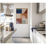Abstract geometric wall art with navy, beige, rust, pink, lavender, and sage rectangles and semicircles in a bright kitchen with light gray countertops and white cabinets.