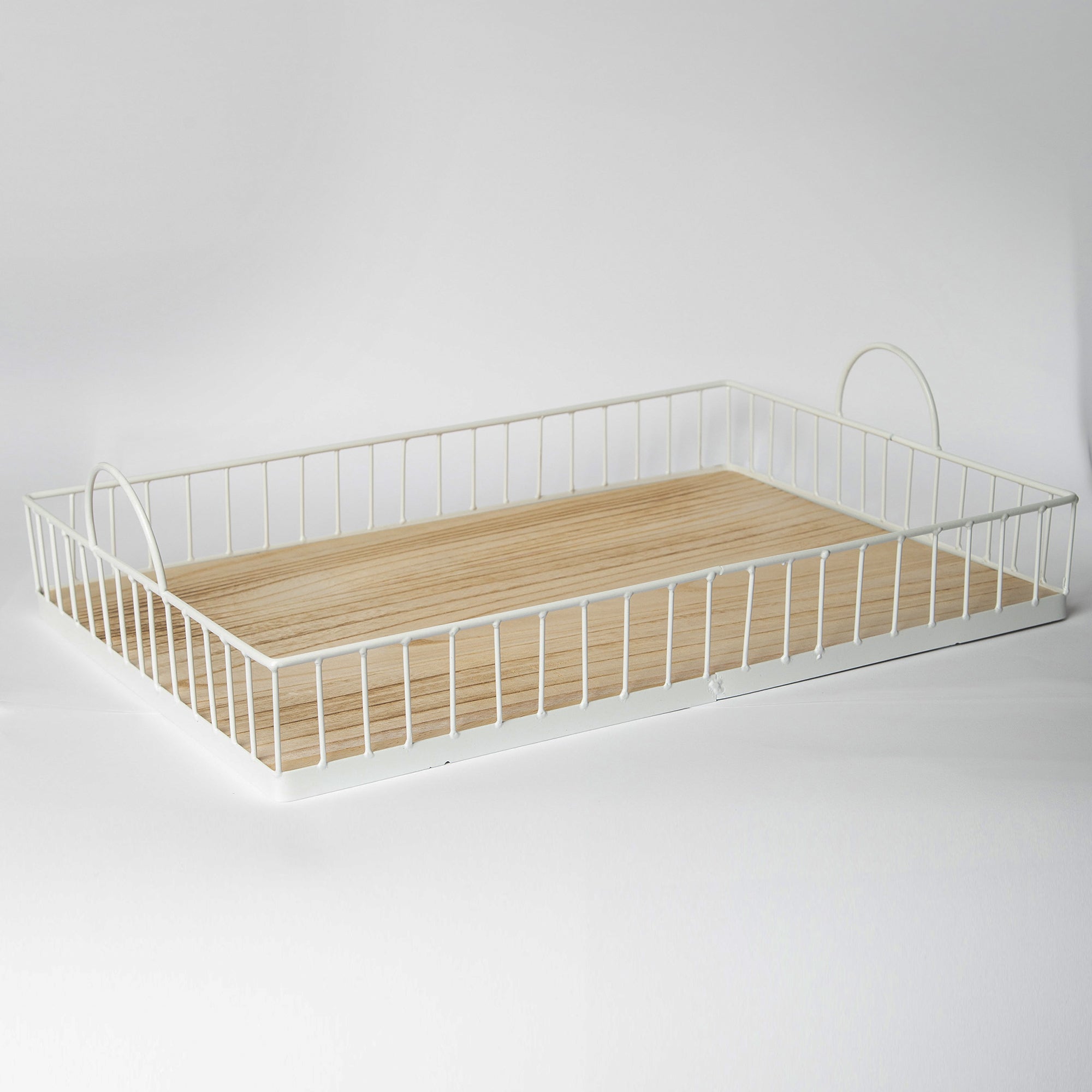 Rectangular white metal and wood tray with raised edges displayed on a surface