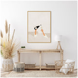 Minimalist wall art showing two raised hands pouring champagne from a bottle into a flute against a simple beige background, framed in light wood.