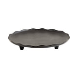 Dark gray decorative tray with a subtly wavy scalloped rim and three short, sturdy legs, shown from a side angle against a white background.