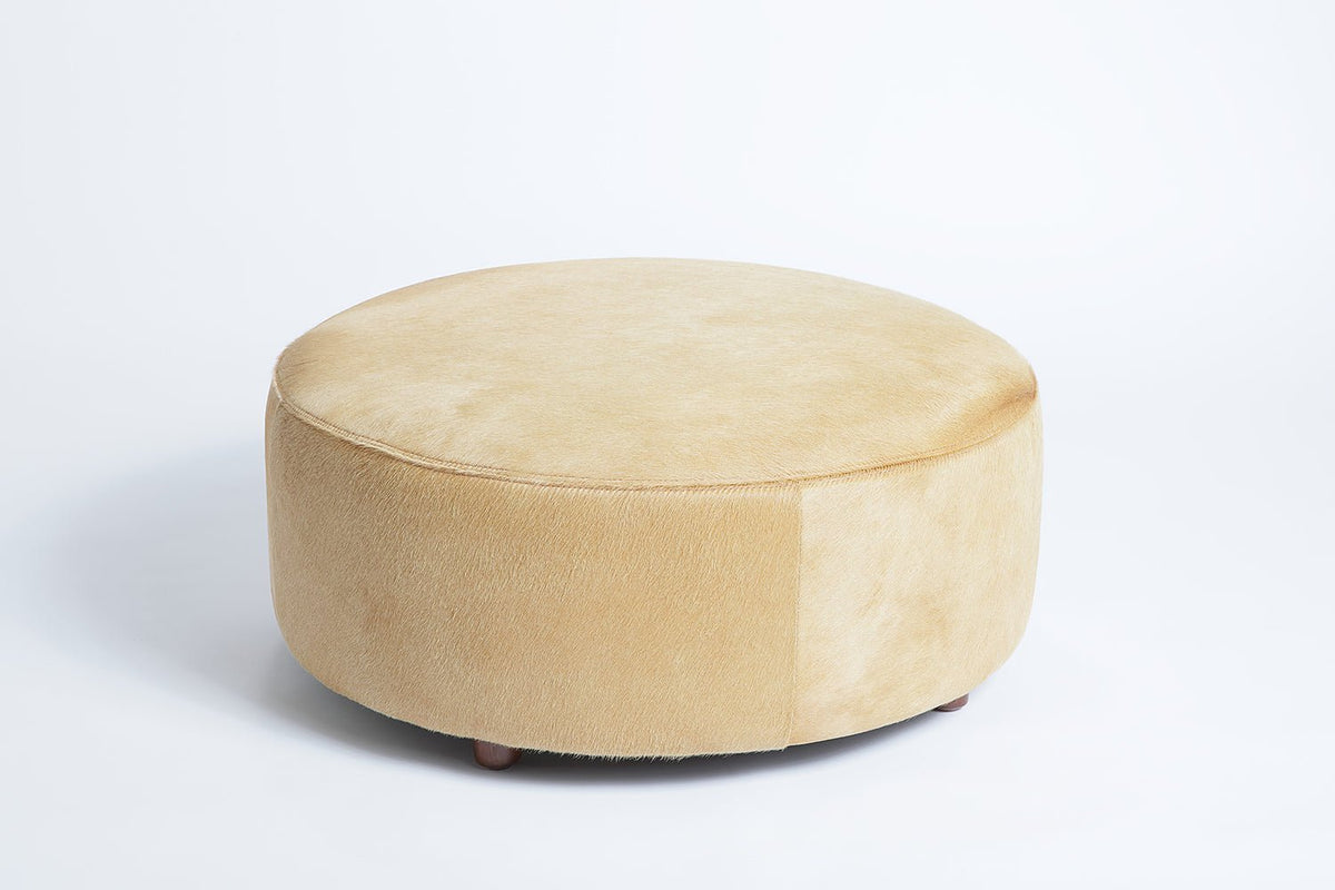 Round Cowhide Ottoman by Homelosophy