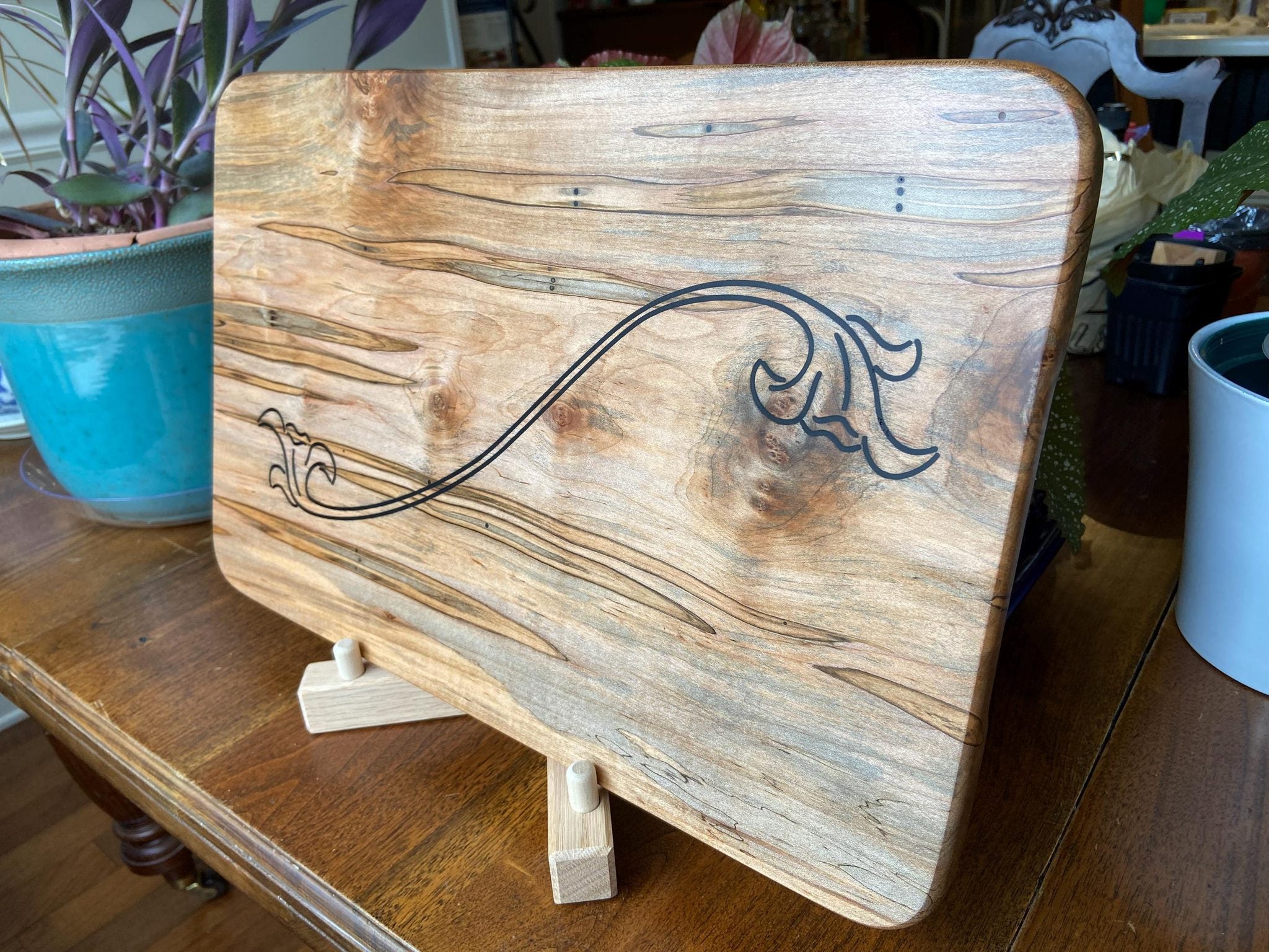 Ambrosia Maple charcuterie board with flower scroll resin inlay by Fitzgerald Custom Woodcraft