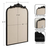 Beige fabric pinboard with antique black arch frame topped by ornate crown detail, featuring keyhole hangers on the back for wall mounting, measuring 19 by 30.75 inches.