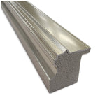 Close-up of a silver metallic picture frame molding with a textured back and smooth, grooved front surface angled to show its cross-section and profile.