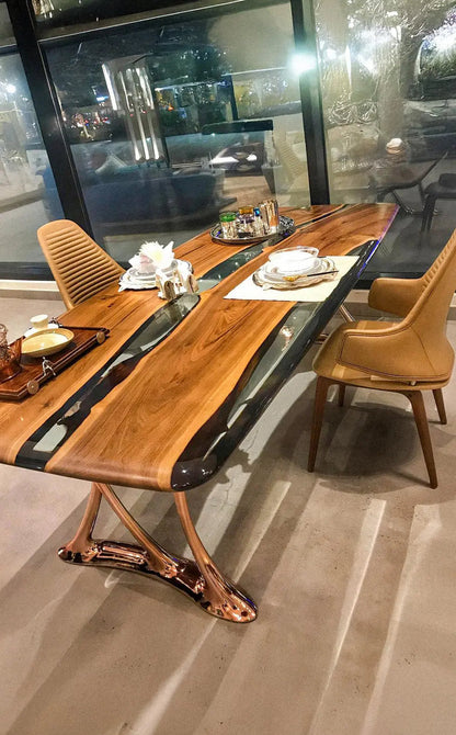 Custom epoxy resin dining room table with walnut wood and rose gold aluminum legs