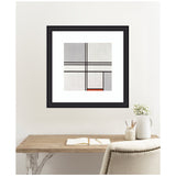 Abstract geometric artwork with intersecting black lines creating rectangles filled with gray, white, and a small red block, framed in black on a white wall above a desk.