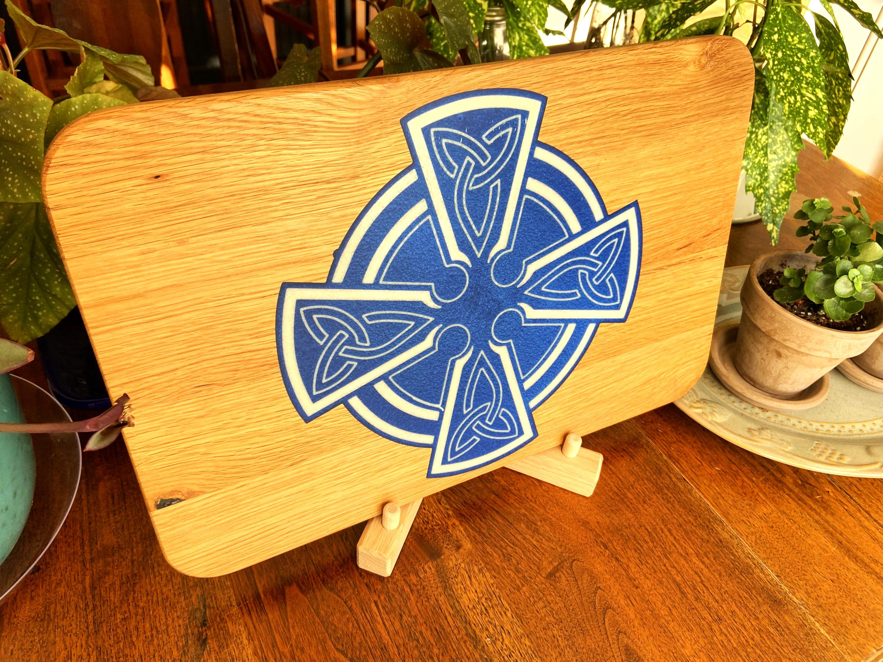 Handmade Celtic Cross charcuterie board in white oak with white on blue resin inlay